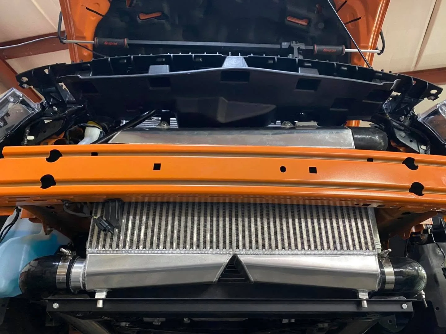 A heat exchanger fitted behind the bumper of a Mustang